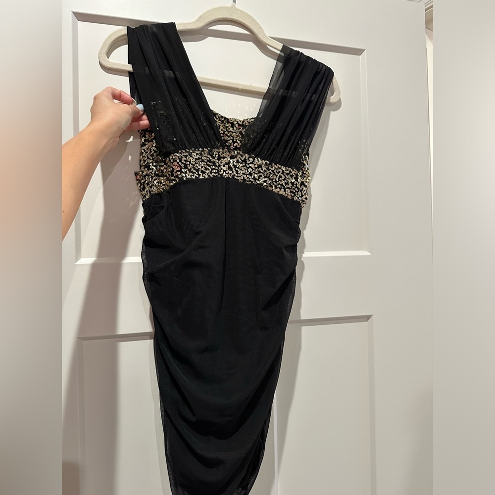 Mini black dress with golden accents